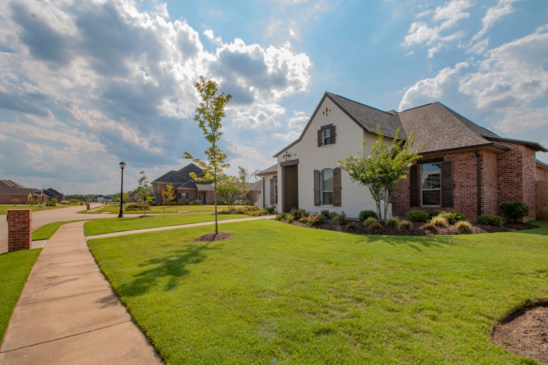 Home white-and-brown-house-near-green-grass-field-under-white-clouds-and-blue-sky-during-daytime-9ggvnwbeoq4